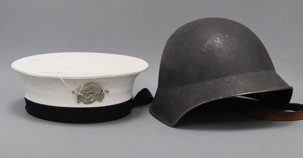 A Russian sailors cap with numbered label and attached skull and crossbones badge, and a steel helmet with original leather fittings
